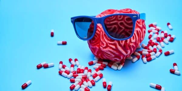 An illustration of a brain wearing glasses.