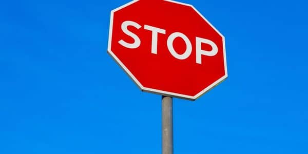 Stop sign against the blue sky.