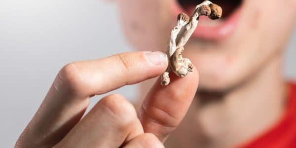 A person eating mushrooms.